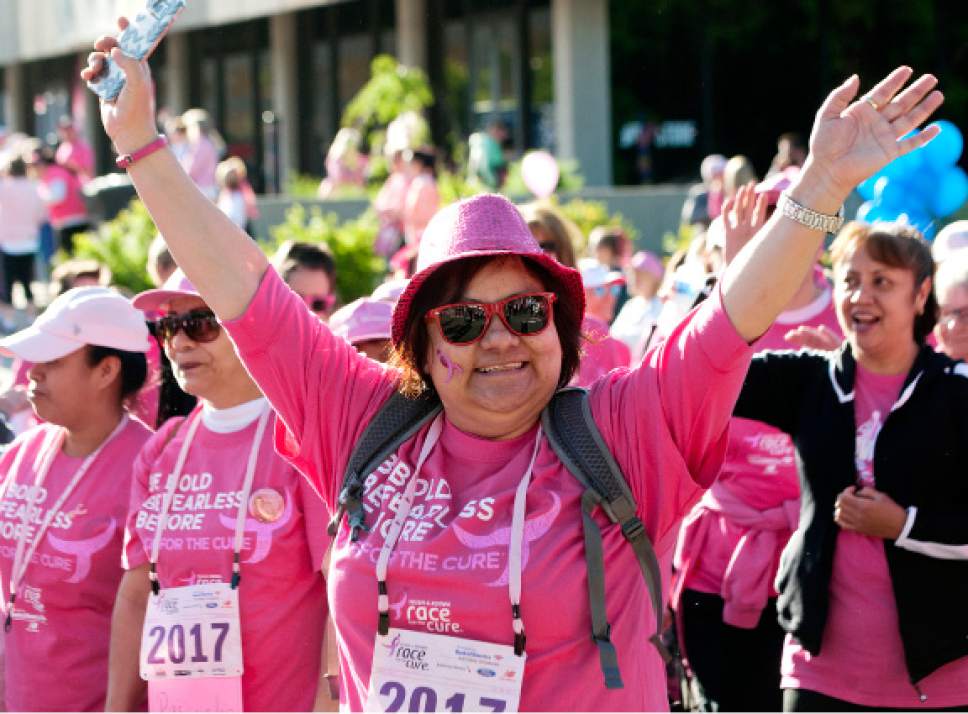 Michael Mangum  |  Special to The Tribune

Cancer survivors walk in the Survivors Parade before the beginning of the Susan G. Komen Race for the Cure in Salt Lake City on Saturday, May 13, 2017.