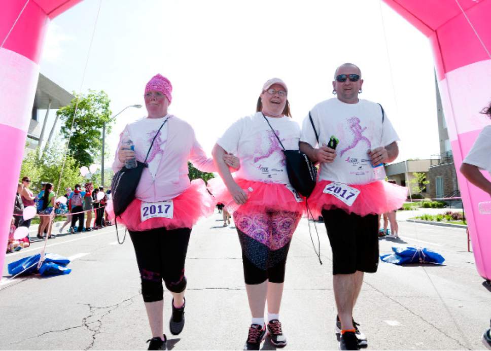 Michael Mangum  |  Special to The Tribune

Rachel Mackay, left, of Magna, Rebecca Anjewierden, and Steffan Mackay cross the finish line during the Susan G. Komen Race for the Cure in Salt Lake City on Saturday, May 13, 2017. It was the first Komen race for the trio, who say they plan to make it an annual event for their family as they run in support of Steffan Mackay's aunt and grandmother, who are cancer survivors.