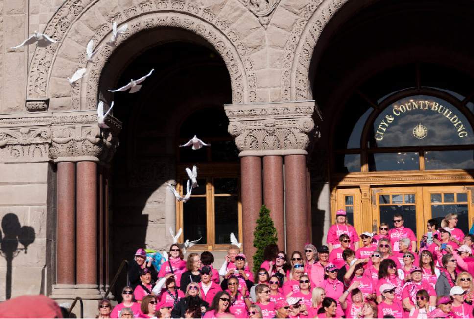 Michael Mangum  |  Special to the Tribune

Cancer survivors pose for a group photo while doves are released during the Survivors Parade before the beginning of the Susan G. Komen Race for the Cure in Salt Lake City on Saturday, May 13, 2017.
