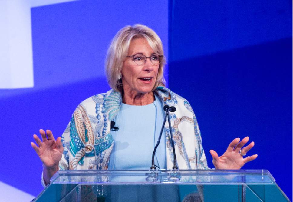 U.S. Department of Education Secretary Betsy DeVos speaks to the crowd at the ASU + GSV Summit at the Grand America Hotel in Salt Lake City, Tuesday, May 9, 2017. DeVos is reiterating her push for school choice during an annual education technology conference, comparing the issue to being able to switch between phone service providers. (Leah Hogsten/The Salt Lake Tribune via AP)