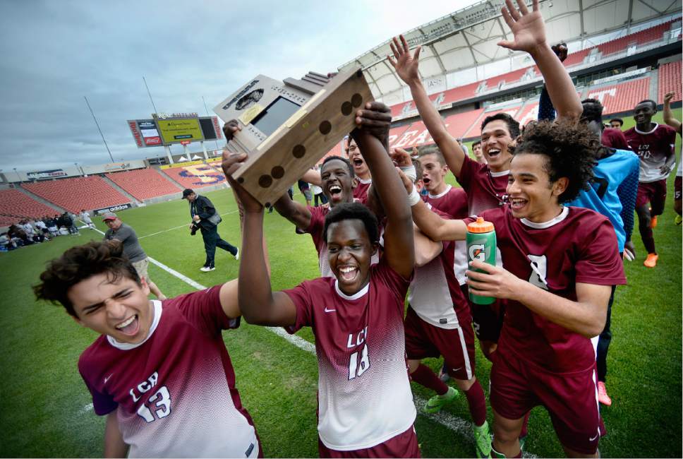 Scott Sommerdorf | The Salt Lake Tribune
Layton Christian Academy celebrates their 2A trophy after beating South Summit 1-0 to win the championship at Rio Tinto Stadium, Saturday, May 13, 2017.
