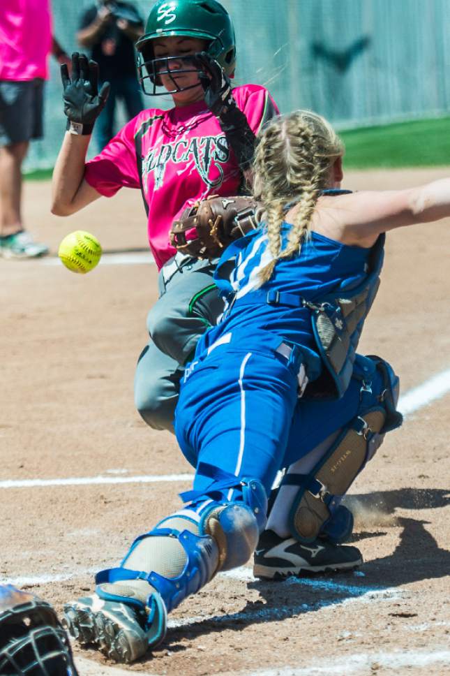 Chris Detrick  |  The Salt Lake Tribune
South Summit's Alayna Hansen (9) slides safely into home past Beaver's Tavy Gale (10) during the Class 2A state softball title game at Spanish Fork Complex Saturday, May 13, 2017.