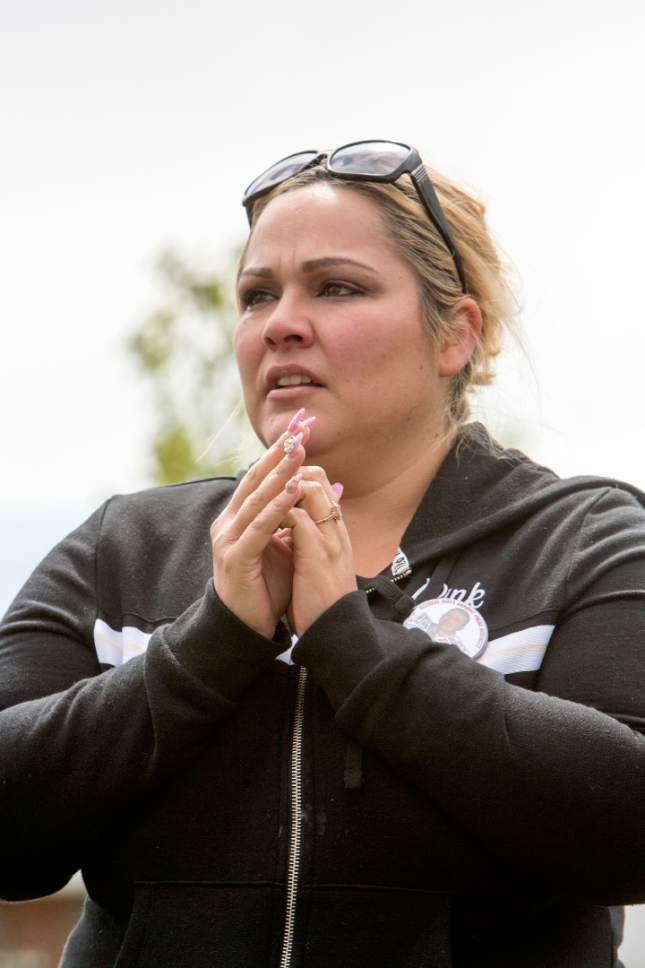 Briana Scroggins  |  Special to the Tribune


Lady Hernandez, mother of Nicolas Sanchez's 15-year-old daughter, of Orange County, Cali., places her hands together and tears up as she talks to participants during a protest organized by Utah Against Police Brutality at the Roy Police Department in response to the death of Nicolas Sanchez on Saturday, May 13, 2017 in Roy.
A Roy Police officer got into a struggle with Sanchez, who was armed, on Feb. 21, 2017 at a gas station in Roy. Sanchez was shot multiple times by the two officers at the scene.