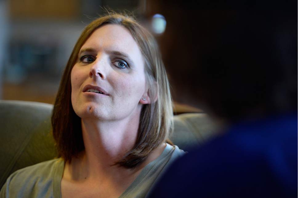 Scott Sommerdorf | The Salt Lake Tribune
Ann Pack, a transgender woman, listens as her wife, Brigit, speaks about their lives and their relationships with their daughter.