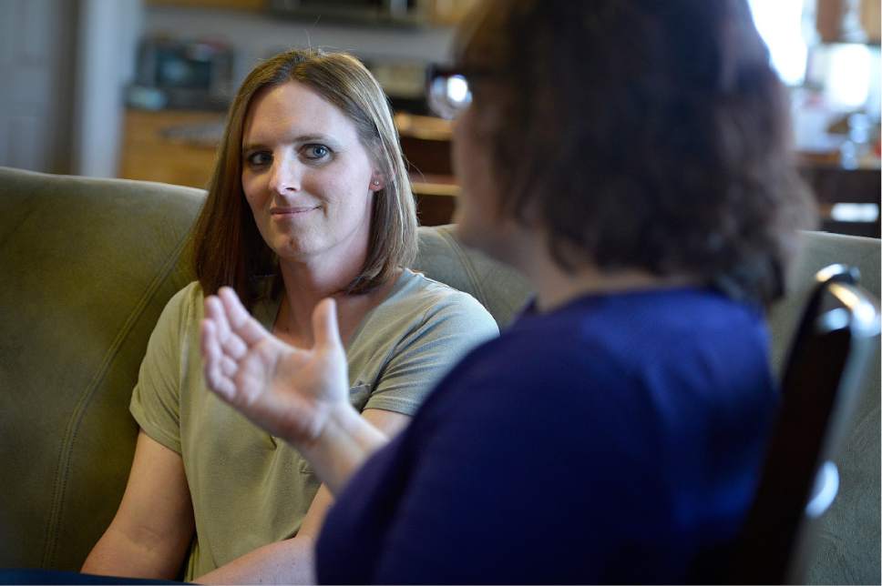 Scott Sommerdorf | The Salt Lake Tribune
Ann Pack, a transgender woman, listens as her wife, Brigit, speaks about their lives and their relationships with their daughter.