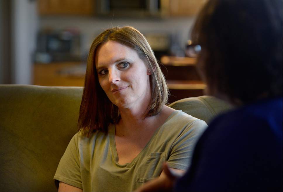 Scott Sommerdorf | The Salt Lake Tribune
Ann Pack, a transgender woman, listens as her wife, Brigit, speaks about their lives and their relationships with their daughter.
