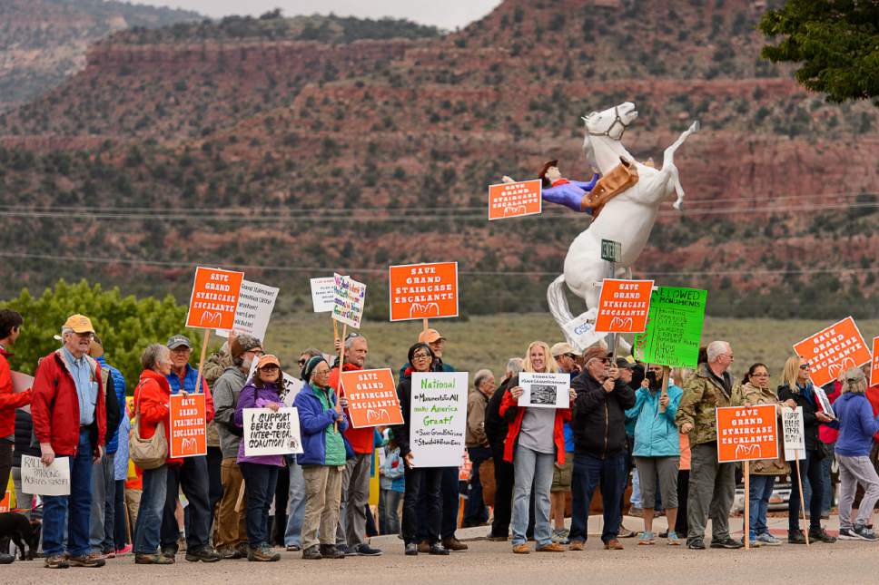 Trent Nelson  |  The Salt Lake Tribune
People hold signs up for passing cars at a Monument Rally and Business Owner's Press Conference in Kanab, Wednesday May 10, 2017. The event was planned to occur in conjunction with Interior Secretary Ryan Zinke's visit to Grand Staircase-Escalante National Monument.