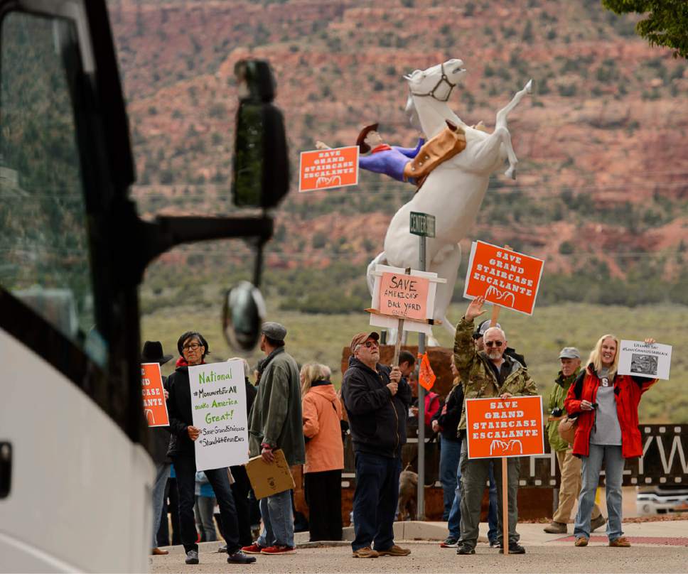 Trent Nelson  |  The Salt Lake Tribune
People hold signs up for passing vehicles at a Monument Rally and Business Owner's Press Conference in Kanab, Wednesday May 10, 2017. The event was planned to occur in conjunction with Interior Secretary Ryan Zinke's visit to Grand Staircase-Escalante National Monument.