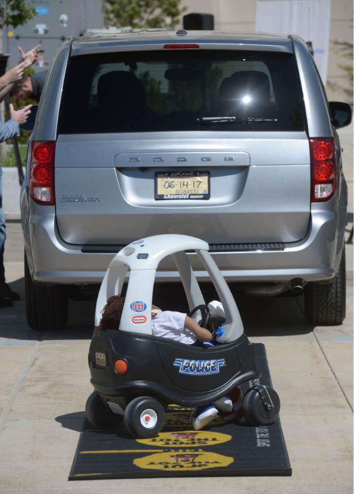 Al Hartmann  |  The Salt Lake Tribune
Automobile and child's toy used in Spot the Tot demonstration at Intermountain Primary Children's Hospital Monday May 15.   It urges the public to look for children before getting into the car and backing out of driveways.
