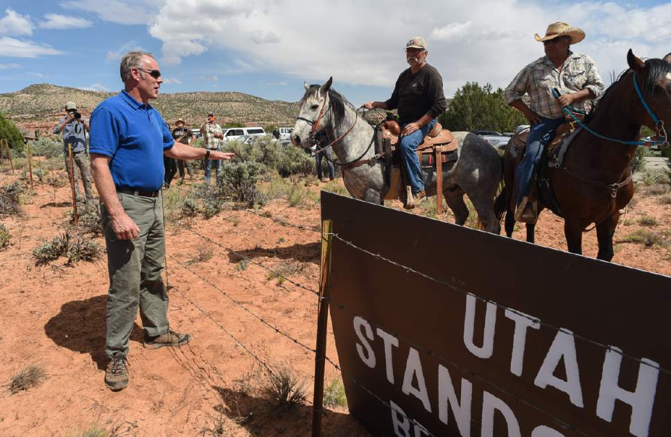 Francisco Kjolseth | The Salt Lake Tribune
Interior Secretary Ryan Zinke speaks with Willy Grayeyes, center, and Leroy Teeasyaton of Utah Dine Bikeyah following a short hike to Butler Wash Indian Ruins by the secretary and members of the Utah delegation during a tour of the Bears Ears National Monument on Monday, May 8, 2017.