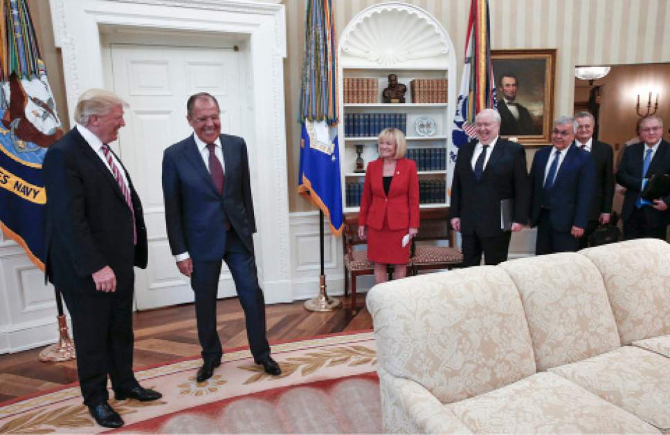 U.S. President Donald Trump meets with Russian Foreign Minister Sergey Lavrov, second left, at the White House in Washington, Wednesday, May 10, 2017. Trump on Wednesday welcomed Vladimir Putin's top diplomat to the White House for Trump's highest level face-to-face contact with a Russian government official since he took office in January. Fourth from right is Russian Ambassador to the U.S. Sergei Kislyak. (Russian Foreign Ministry Photo via AP)