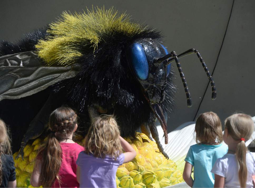 Al Hartmann  |  The Salt Lake Tribune
Children are fascinated by the giant red-tailed bumblebee, one of 14 animatronic bugs at Utah's Hogle Zoo that will be on the grounds all summer as part of an effort to educate the public about the importance of bugs in the circle of life.