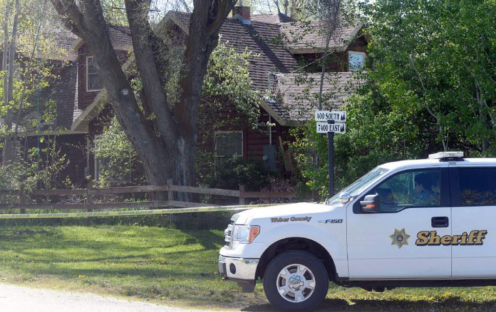 Al Hartmann  |  The Salt Lake Tribune
Weber County sheriff's deputies investigate a homicide at a residential home in the 7400 East block of 400 South in Huntsville Thursday morning May 11.
