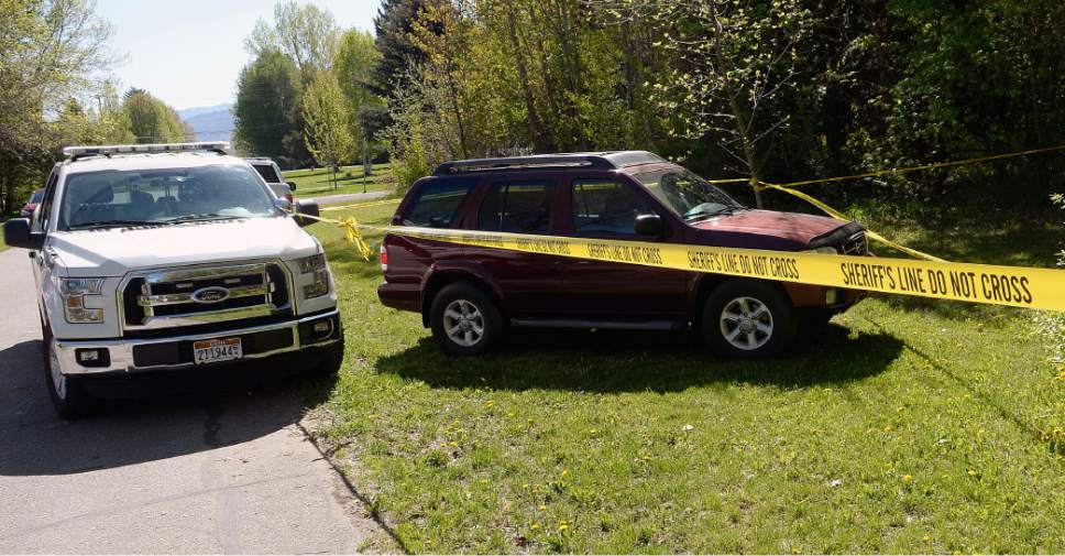 Al Hartmann  |  The Salt Lake Tribune
Weber County sheriff's deputies investigate a homicide at a residential home in the 7400 East block of 400 South in Huntsville Thursday morning May 11.