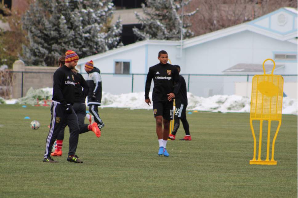 Christopher Kamrani  |  The Salt Lake Tribune

RSL midfielder Omar Holness (center) and defender Chris Wingert (left) chat during Tuesday's training session at America First Field in Sandy.