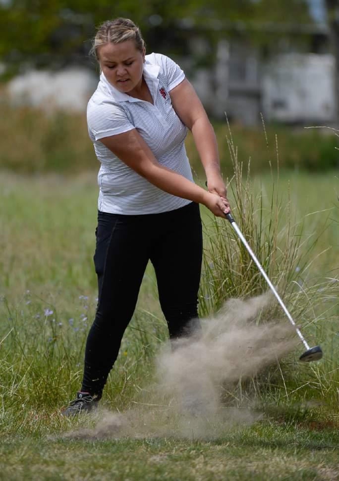 Francisco Kjolseth | The Salt Lake Tribune
Kassidy Groves of Spanish Fork digs out of the rough in the 4A Girls High School State Championship at Meadowbrook golf course in Taylorsville on Monday, May 15, 2017.