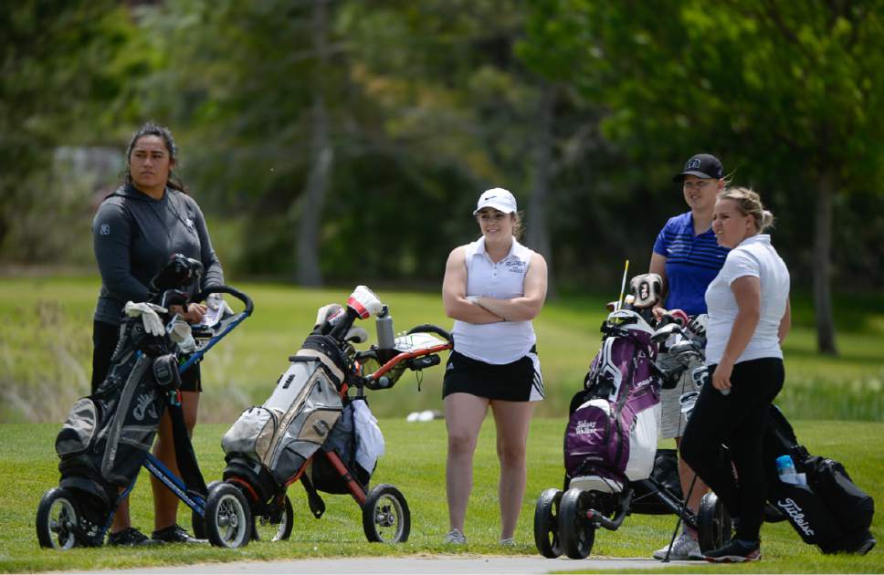 Francisco Kjolseth | The Salt Lake Tribune
Naomi Soifua of Provo, Tori Treseder of Hillcrest, Sidney Walker of Box Elder and Kassidy Groves of Spanish Fork, from left, wait for a group to move ahead in the 4A Girls High School State Championship at Meadowbrook golf course in Taylorsville on Monday, May 15, 2017.