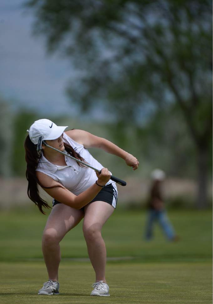 Francisco Kjolseth | The Salt Lake Tribune
Tori Treseder of Hillcrest contorts her body as she tries to will the ball into the cup in the 4A Girls High School State Championship at Meadowbrook golf course in Taylorsville on Monday, May 15, 2017.