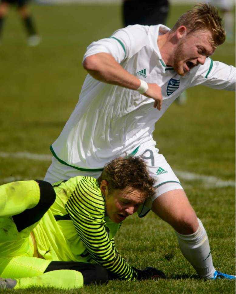 Steve Griffin  |  The Salt Lake Tribune


Jake Singleton, of Copper Hills, crashes into Lone Peak goal keeper Robbie Swanson during playoff game against Lone Peak at Copper Hills in West Jordan Tuesday May 16, 2017.