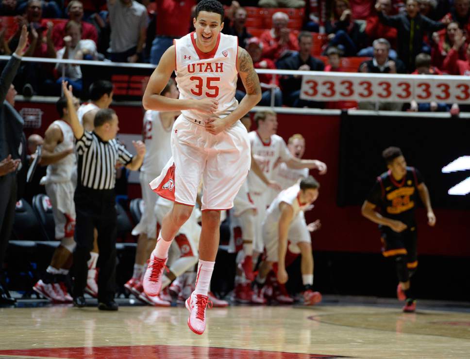 Scott Sommerdorf   |  The Salt Lake Tribune
Utah Utes forward Kyle Kuzma (35) jumps as he celebrates a 3-point shot by little-used Utah Utes guard Austin Eastman (15) as he got some playing time late in the rout. Utah defeated the USC Trojans 79-55, Friday, January 2, 2015.