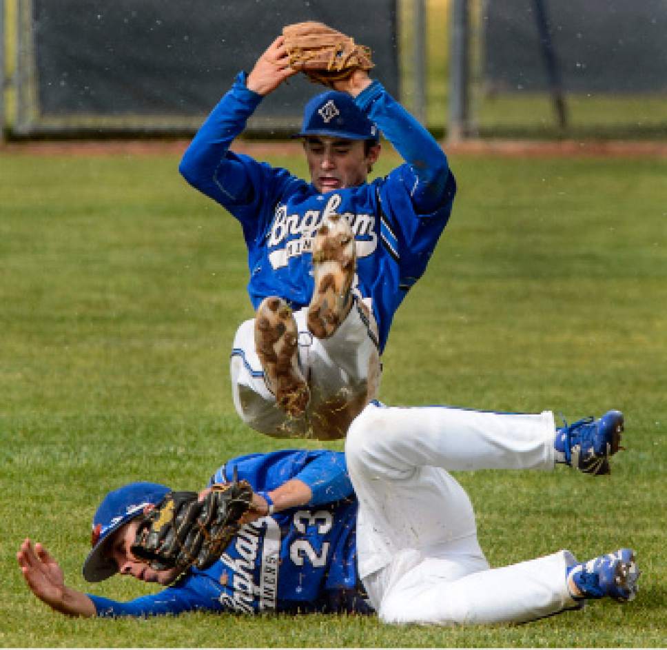 Steve Griffin  |  The Salt Lake Tribune



Bingham second baseman Max McCoy flips backwards as centerfielder Matt Degn slides knocking him into the air as the pair chased down a pop fly during class 5A baseball state playoff game against Roy and Bingham High School in South Jordan Wednesday May 17, 2017.