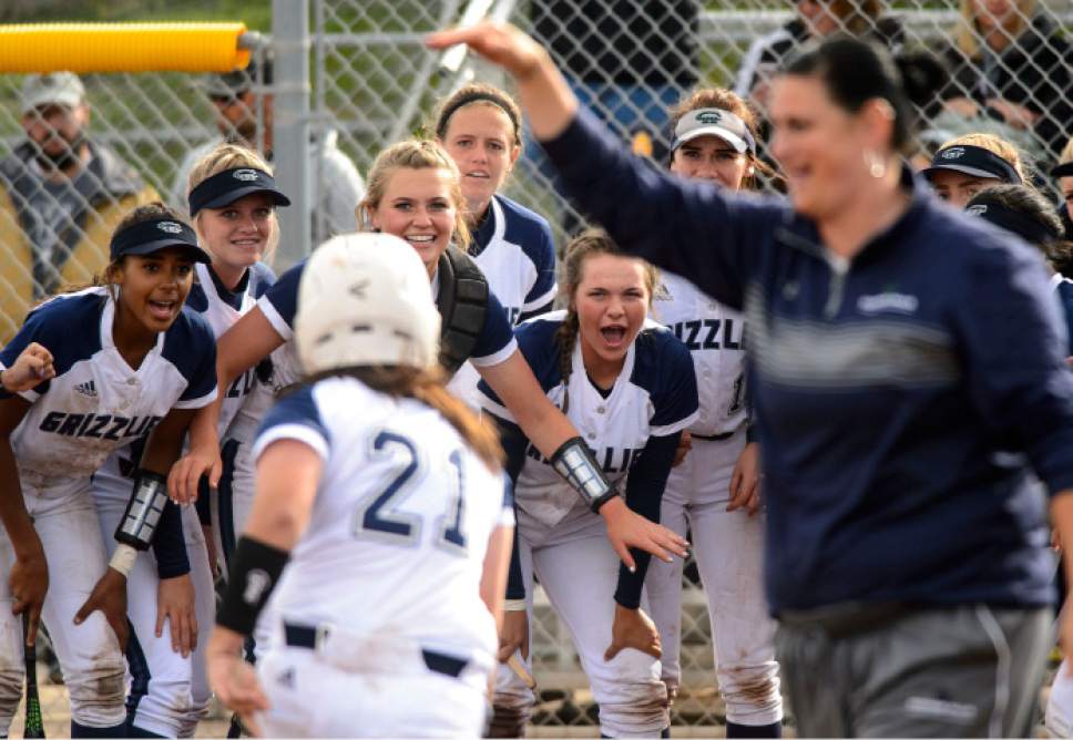 Steve Griffin  |  The Salt Lake Tribune


Copper Hills players surround home plate as they wait for teammates Chloe Crebs as she rounds the bases after blasting a home run during the Class 5A softball playoff opener between Riverton and Copper Hills in West Jordan Tuesday May 16, 2017.
