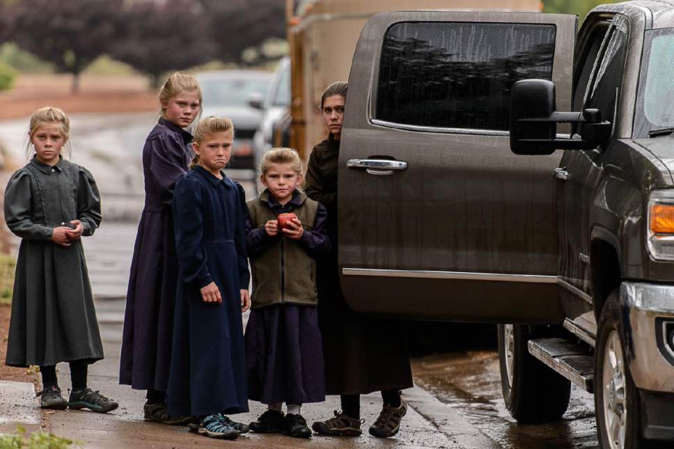 Trent Nelson  |  The Salt Lake Tribune
FLDS children look on after being evicted from their Colorado City, AZ, home by the UEP Trust after refusing to sign an occupancy agreement, Wednesday May 10, 2017.
