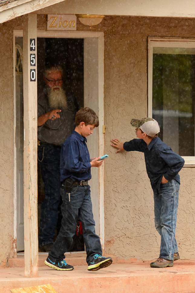 Trent Nelson  |  The Salt Lake Tribune
Mohave County Constable Mike Hoggard orders FLDS boys away from a Colorado City, AZ, home where the locks are being changed, Tuesday May 9, 2017. One of the boys had been taking videos of the eviction process.