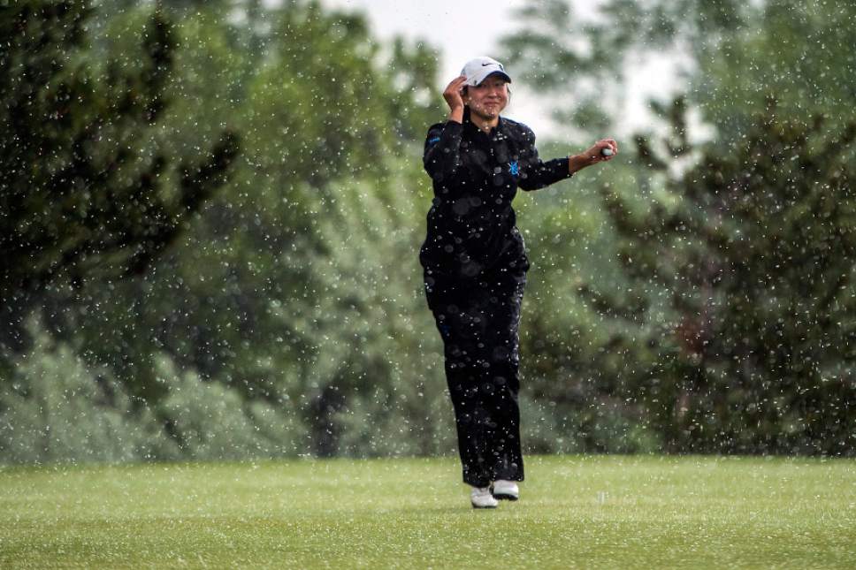 Chris Detrick  |  The Salt Lake Tribune
Bingham's Tess Blair marks her spot on the green during a rain delay during the Class 5A girls' golf state meet at Davis Park Golf Course Tuesday, May 16, 2017.