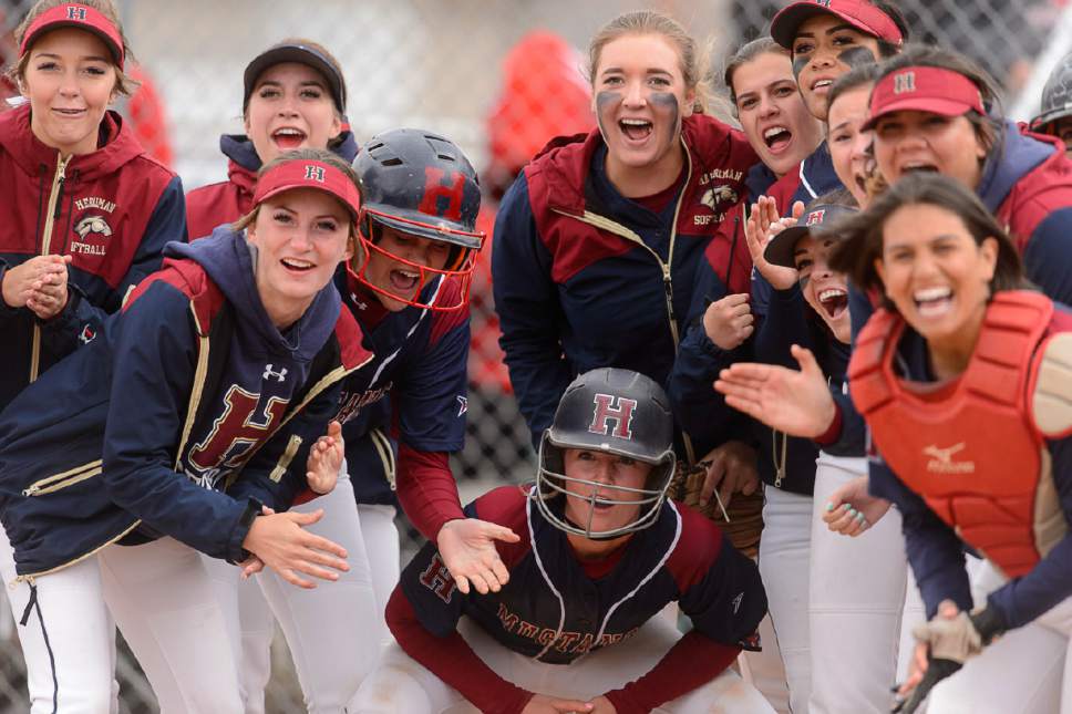 Trent Nelson  |  The Salt Lake Tribune
Herriman players surround home as Herriman's Mikaela Thomson hits a home run. Herriman hosts West High School in a Class 5A softball playoff game, Thursday May 18, 2017.