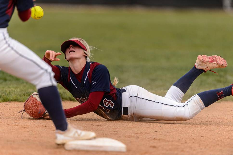 Trent Nelson  |  The Salt Lake Tribune
Herriman's Dayna Hokanson turns a double play as Herriman hosts West High School in a Class 5A softball playoff game, Thursday May 18, 2017.