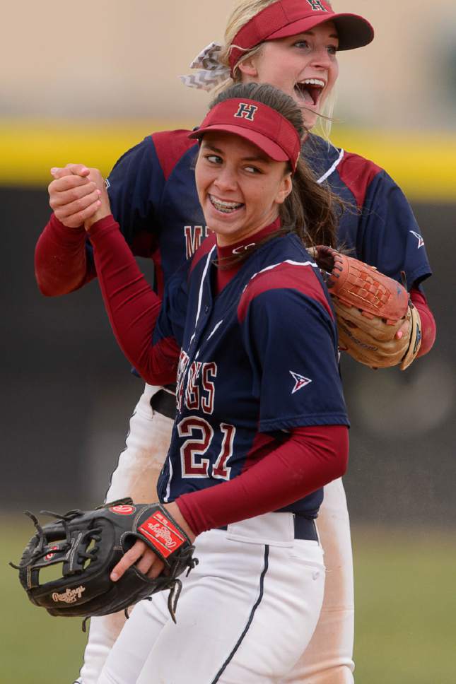 Trent Nelson  |  The Salt Lake Tribune
Herriman's Dayna Hokanson and Herriman's April Visser celebrate a double play as Herriman hosts West High School in a Class 5A softball playoff game, Thursday May 18, 2017.