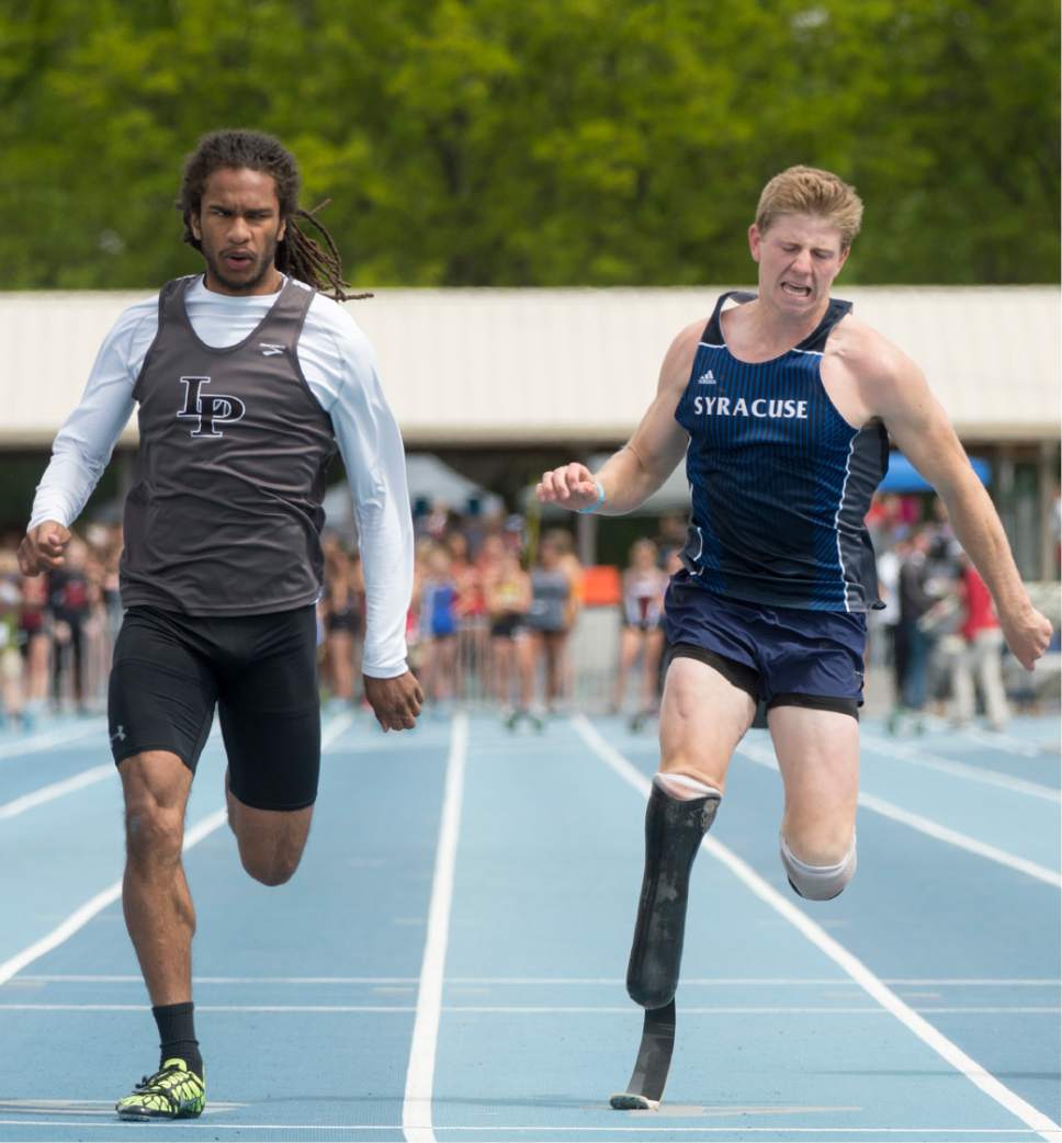 Rick Egan  |  The Salt Lake Tribune

Dominic Beltil, Lone Peak finished ahead of Hunter Woodall, in the preliminary race in the boys 5A 100 Meter run, in the High School Track and Field State Championships, at Clarence Robison Track in Provo, Friday, May 19, 2017.