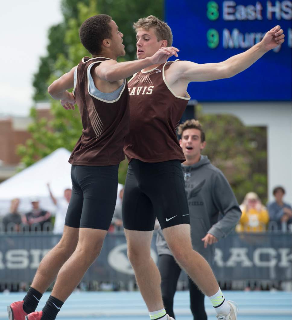Rick Egan  |  The Salt Lake Tribune

Xakai Harry, Davis High, chest-bumps team mate Jonathan Thornton after he cleared the bar as he competes in the Boys 5A high jump finals, High School Track and Field State Championships, at Clarence Robison Track in Provo. Friday, May 19, 2017.