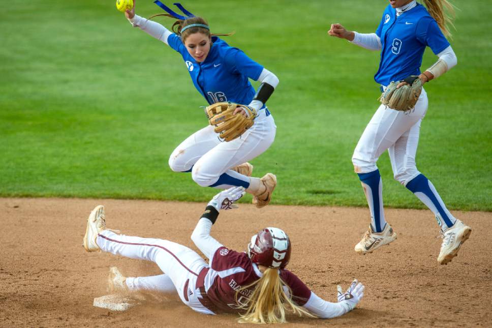 Chris Detrick  |  The Salt Lake Tribune
BYU infielder Alexa Strid (16) jumps over Mississippi St. infielder Reggie Harrison (7) after forcing her out at second base. during the NCAA softball regional game at Dumke Family Softball Stadium Thursday, May 18, 2017. BYU defeated Mississippi St. 8-0.