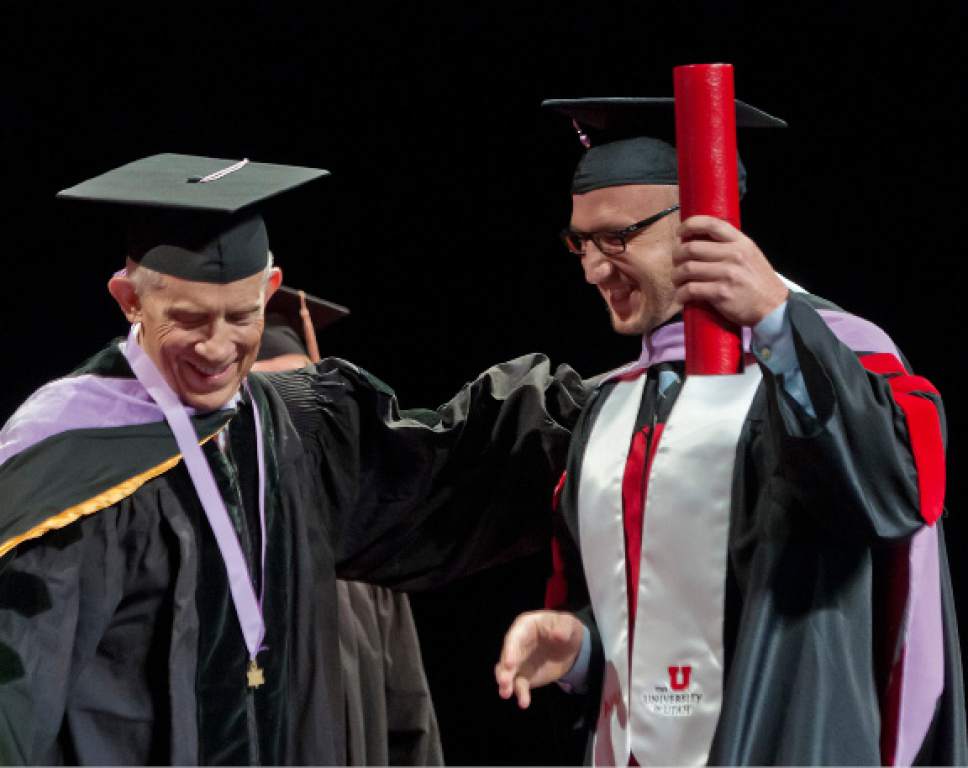 Michael Mangum  |  Special to the Tribune
Associate Dean Glen R. Hanson presents Daniel Hoopes with his diploma during the University of Utah School of Dentistry inaugural commencement ceremonies at Kingsbury Hall on Saturday, May 20th, 2017.