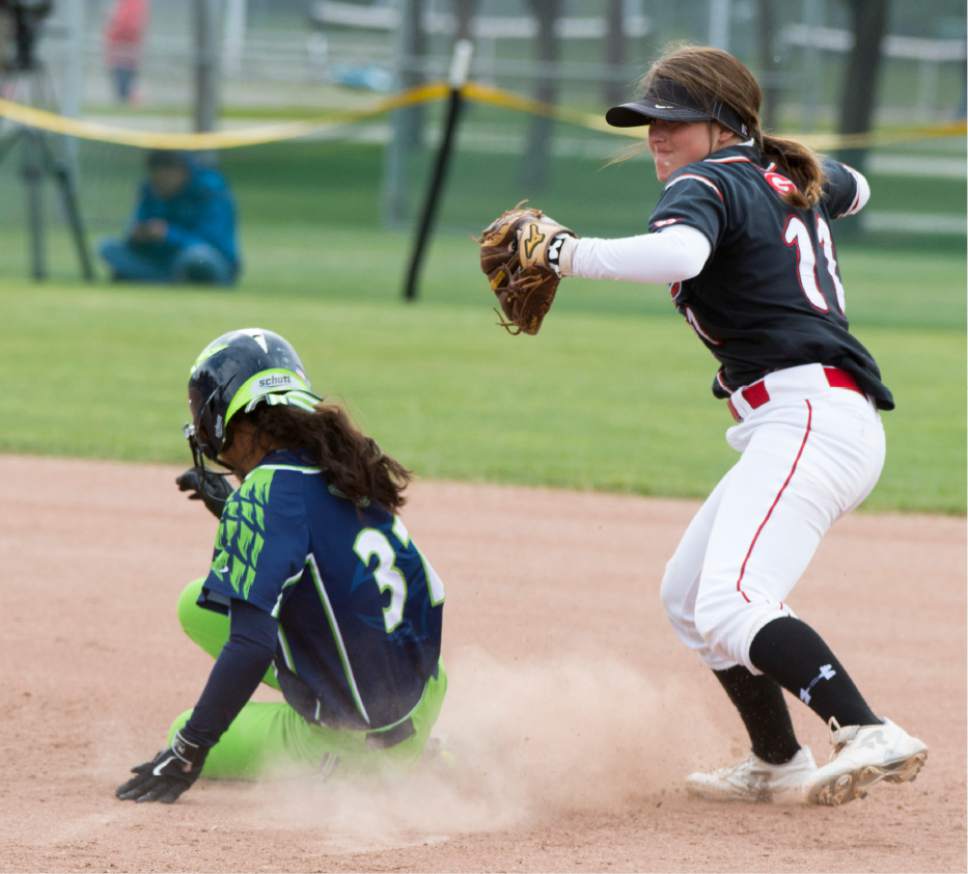 Rick Egan  |  The Salt Lake Tribune

Grantsville second baseman Maizie Clark (11) throws to first after tagging out Ridgeline Riverhawks runner Islay May Kekauoha , in the Class 3A softball state semifinals, Grantsville Vs. Ridgeline, Friday, May 19, 2017.