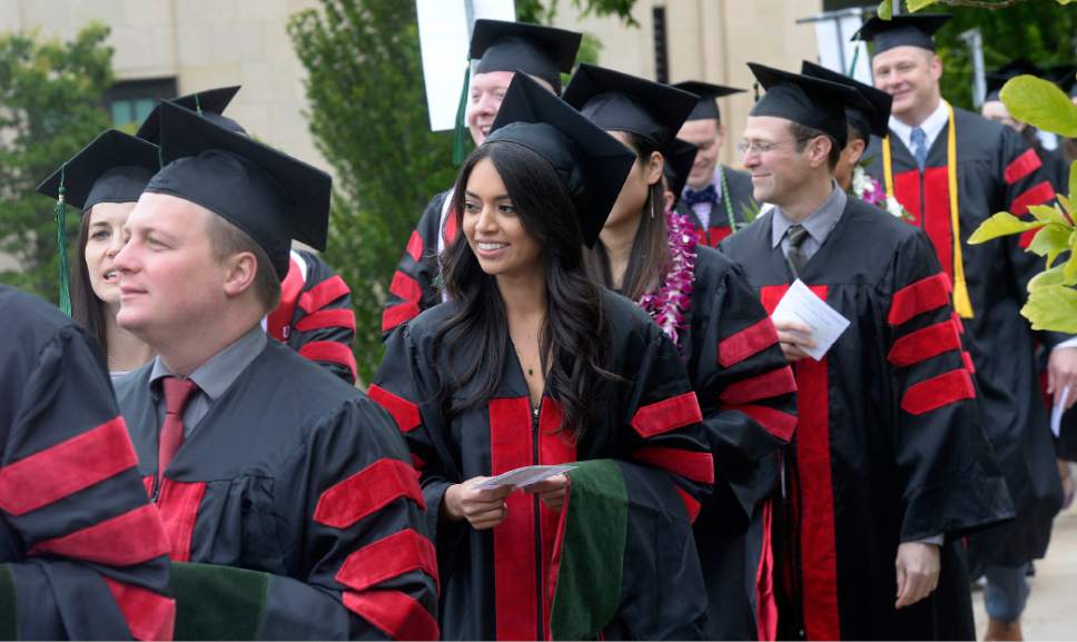 Al Hartmann  |  The Salt Lake Tribune
Spirits were high as University of Utah  School of Medicine graduates march into Kinsbury Hall Friday May 19 for commencement.  With 297 students graduating it's the first expanded class size from the passage of Senate Bill 42 in 2013.