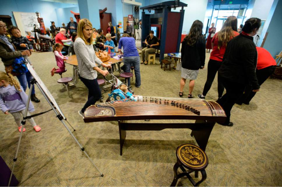 Steve Griffin  |  The Salt Lake Tribune



Guests get a closer look at the Discovery Gateway's newest exhibit, "Children of Hangzhou: Connecting with China" during opening day in Salt Lake City Friday May 19, 2017.
