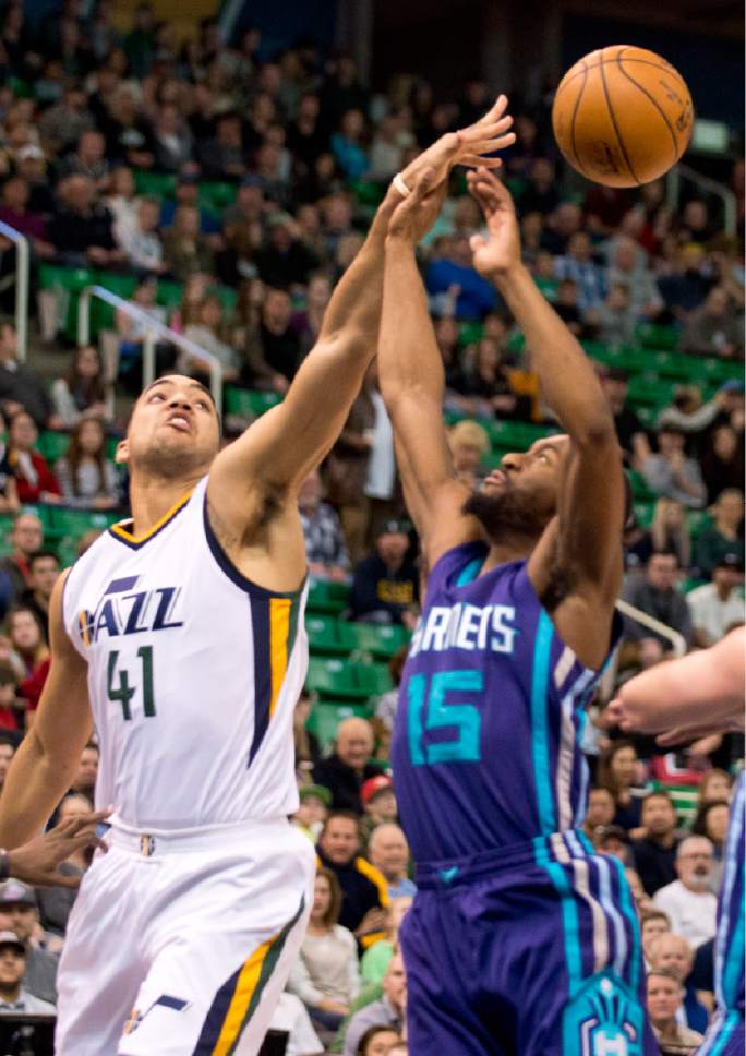 Lennie Mahler  |  The Salt Lake Tribune

Trey Lyles slaps a rebound away from Charlotte's Kemba Walker in a game at Vivint Smart Home Arena on Saturday, Feb. 4, 2017.