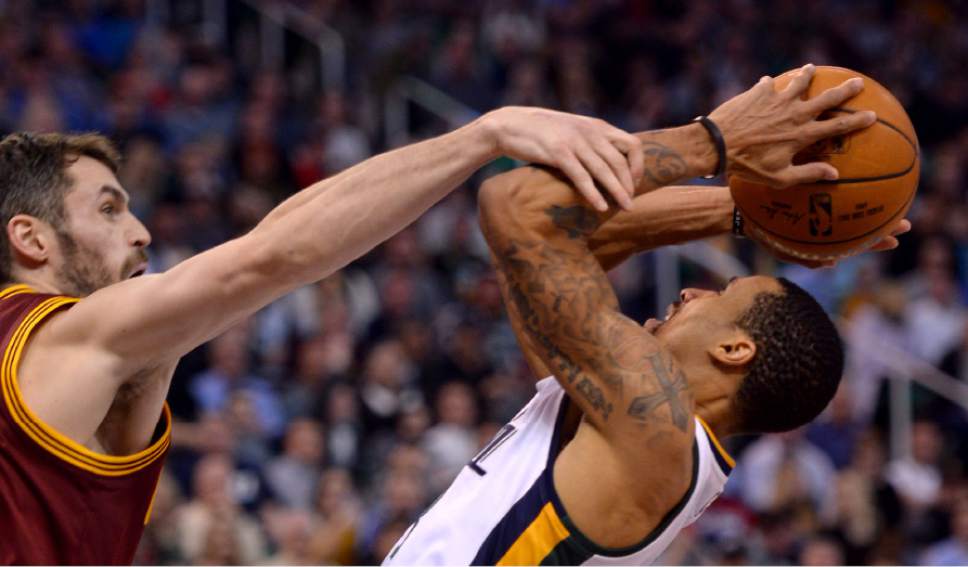Steve Griffin / The Salt Lake Tribune

Cleveland Cavaliers forward Kevin Love (0) fouls Utah Jazz guard George Hill (3) during the Utah Jazz versus Cleveland Cavaliers NBA basketball game at Vivint Smart Home Arena in Salt Lake City Tuesday January 10, 2017.