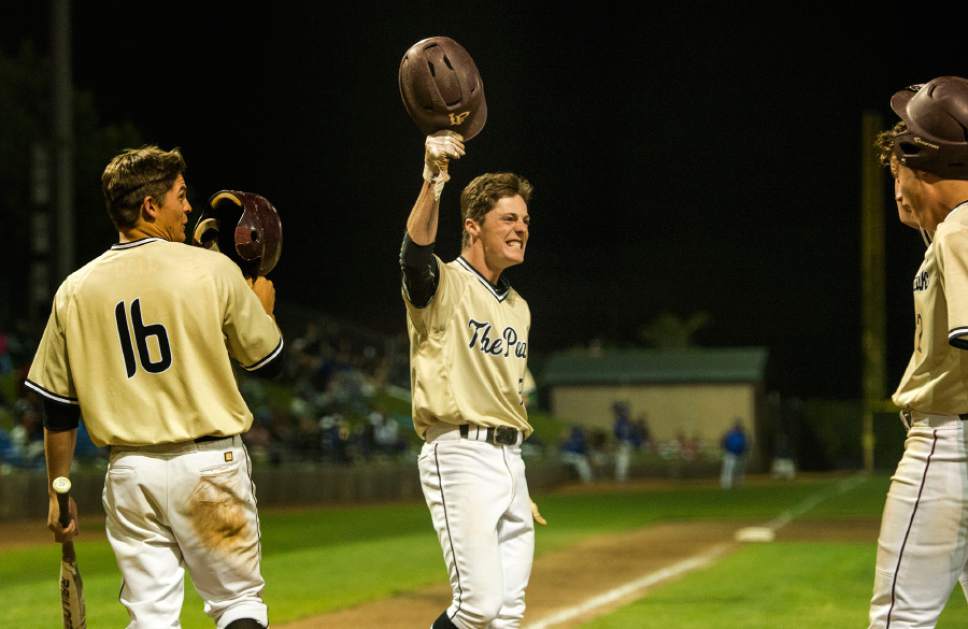 Rick Egan  |  The Salt Lake Tribune

Tate Holmes (13) celebrates after crossing the plate on Eli Norman's  3-run homer in the 4th inning, giving Lone Peak an 11-2 lead  over Bingham, in the 5A baseball quarterfinal between Lone Peak and Bingham, in Kearns, Tuesday, May 23, 2017.