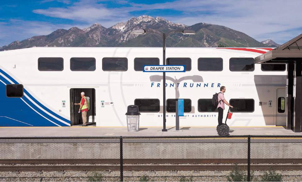 |  Tribune File Photo

People exit a southbound UTA FrontRunner train at the Draper Station on June 6, 2013.