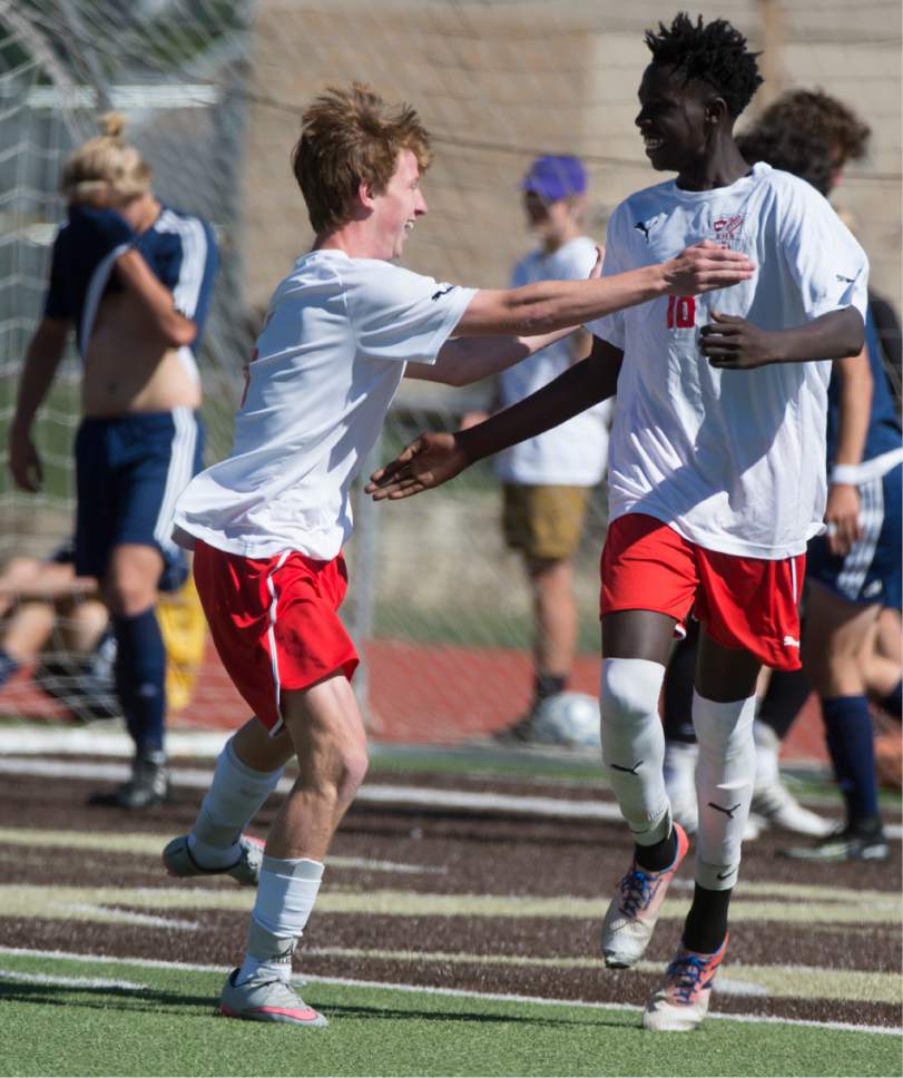 Rick Egan  |  The Salt Lake Tribune

Max Neuberger (5) East High congratulates Ryen Jiba (18) after Jinba scored the first goal of the game for the Leopards, in prep soccer action, 4A boys' state semifinal between Skyline and East in Kaysville, Tuesday, May 23, 2017.