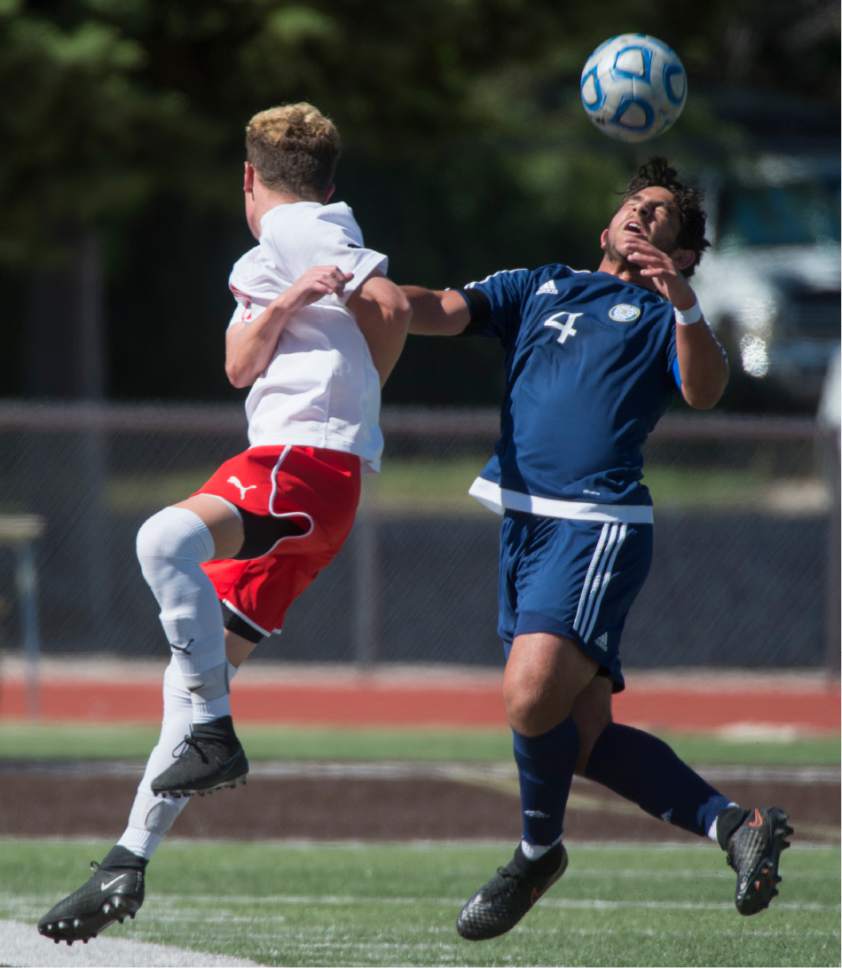 Rick Egan  |  The Salt Lake Tribune

Scott Hulbert (29) East, goes for the ball along with Mesh Abtahi (4) Skyline, in prep soccer action, 4A boys' state semifinal between Skyline and East in Kaysville, Tuesday, May 23, 2017.