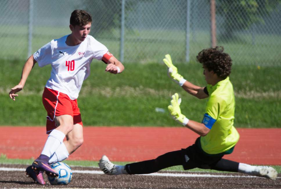 Rick Egan  |  The Salt Lake Tribune

Matt Barker (40) East tries to get the ball past Skyline goal keeper Tommy Jensen (1) in prep soccer action, 4A boys' state semifinal between Skyline and East in Kaysville, Tuesday, May 23, 2017.