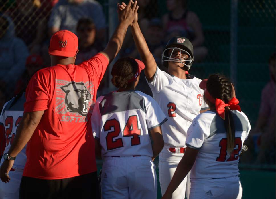 Leah Hogsten  |  The Salt Lake Tribune
West's Daisy Taloa celebrates her scoring run with the team. West High School girls' softball team defeated Syracuse High School 12-0 in five innings to win the quarterfinal game in the Class 5A Softball State playoff tournament at Valley Softball Complex, Tuesday, May 23, 2017.
