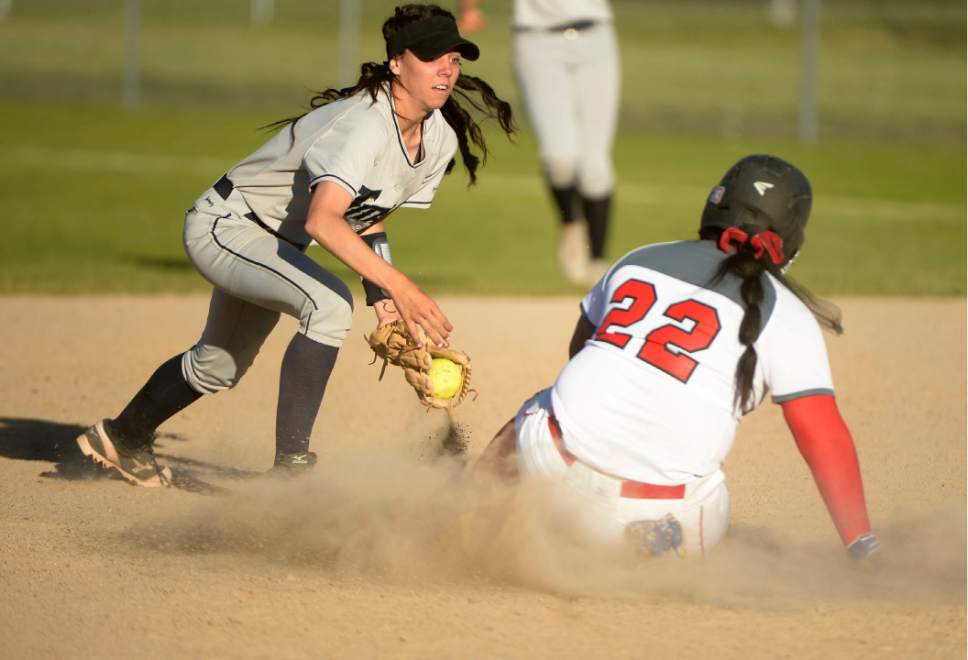 Leah Hogsten  |  The Salt Lake Tribune
West's #22 slides safely back to second base. West High School girls' softball team defeated Syracuse High School 12-0 in five innings to win the quarterfinal game in the Class 5A Softball State playoff tournament at Valley Softball Complex, Tuesday, May 23, 2017.