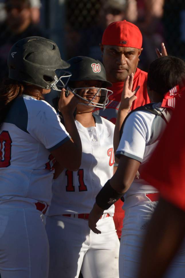 Leah Hogsten  |  The Salt Lake Tribune
West's Keisha White celebrates her scoring run with the team. West High School girls' softball team defeated Syracuse High School 12-0 in five innings to win the quarterfinal game in the Class 5A Softball State playoff tournament at Valley Softball Complex, Tuesday, May 23, 2017.