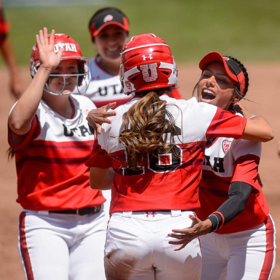 Trent Nelson  |  The Salt Lake Tribune
Utah outfielder Alyssa Barrera (16) and Utah infielder Delilah Pacheco (4) embrace after a run as Utah faces BYU in the final of the Salt Lake City Regional, NCAA softball at Dumke Family Softball Stadium, Saturday May 20, 2017.